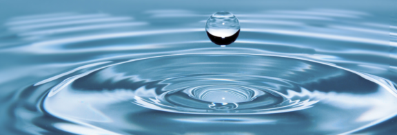 A sphere of water levitates above a ripple of water to accompany news article describing EPA's investment of $41 million in technical assistance for communities' wastewater challenges
